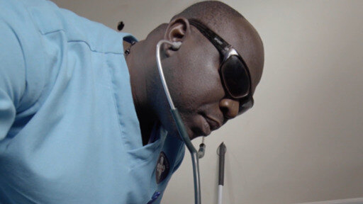 Timothy Okello is thriving at his job and helping to fight stigma against the visually impaired. 